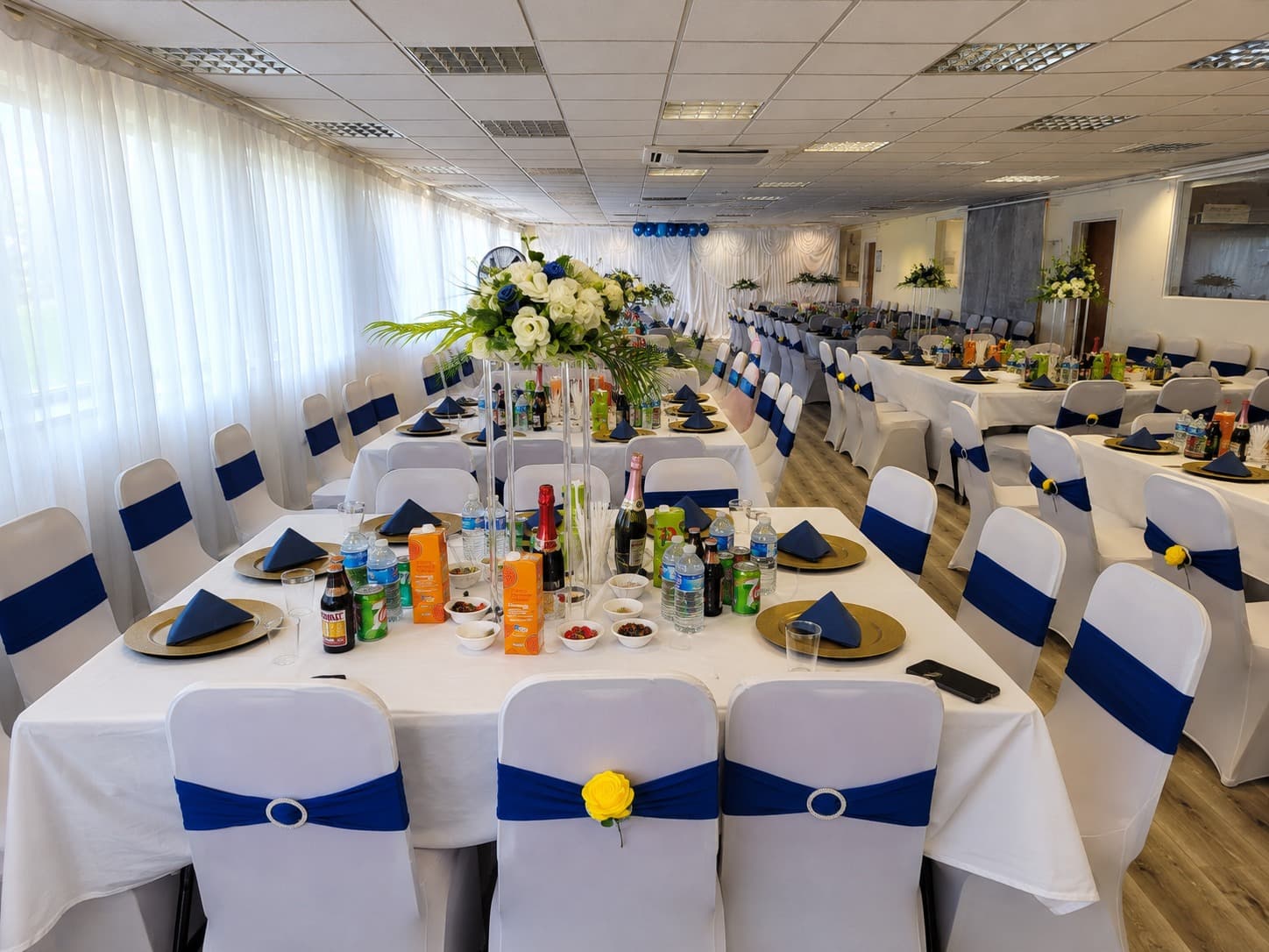 Praise Auditorium dressed for a blue, white and gold celebration